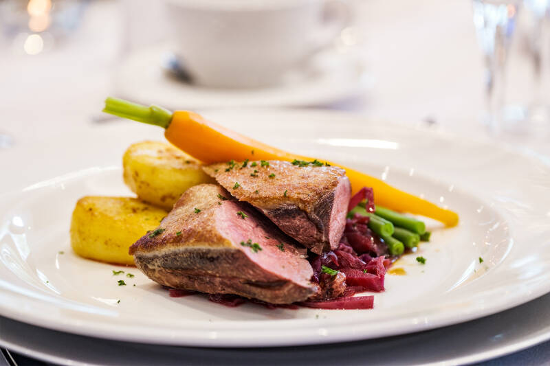 Duck breast with seasonal vegetables