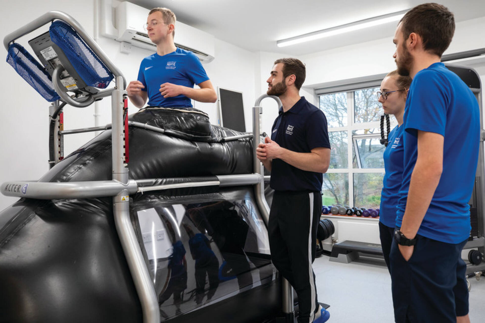 Students in the labs at Kent using the antigravity treadmill