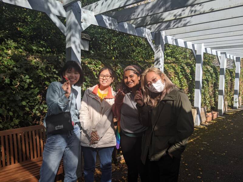 A group of volunteers with peppers that they have grown