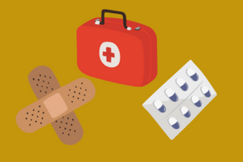 First aid kit, plasters and a packet of medication.