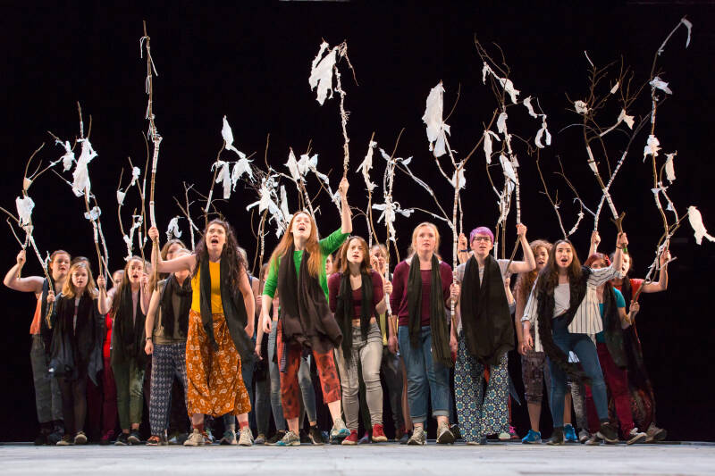 A group of young women performing on a stage