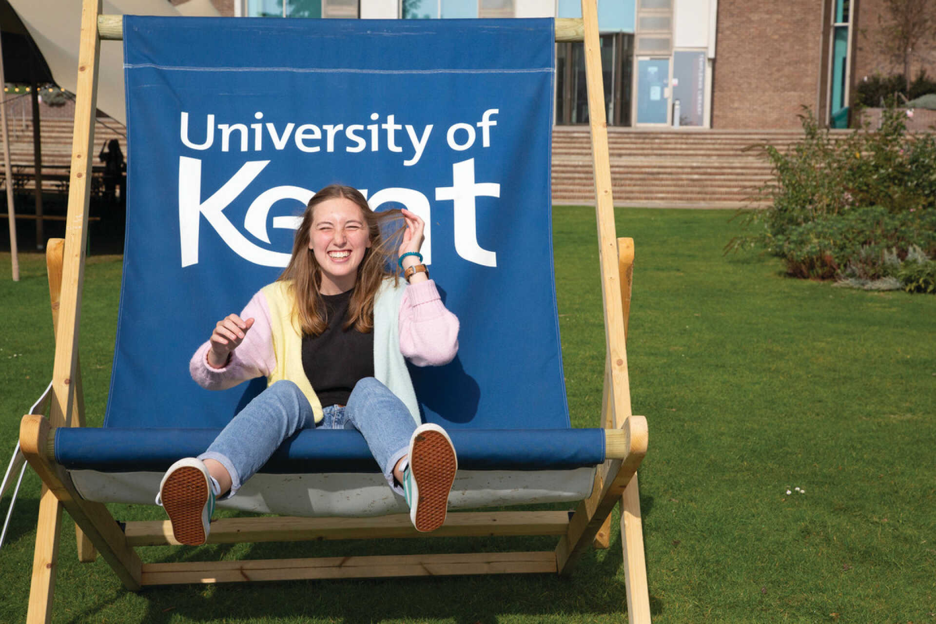 Student on Kent branded deckchair