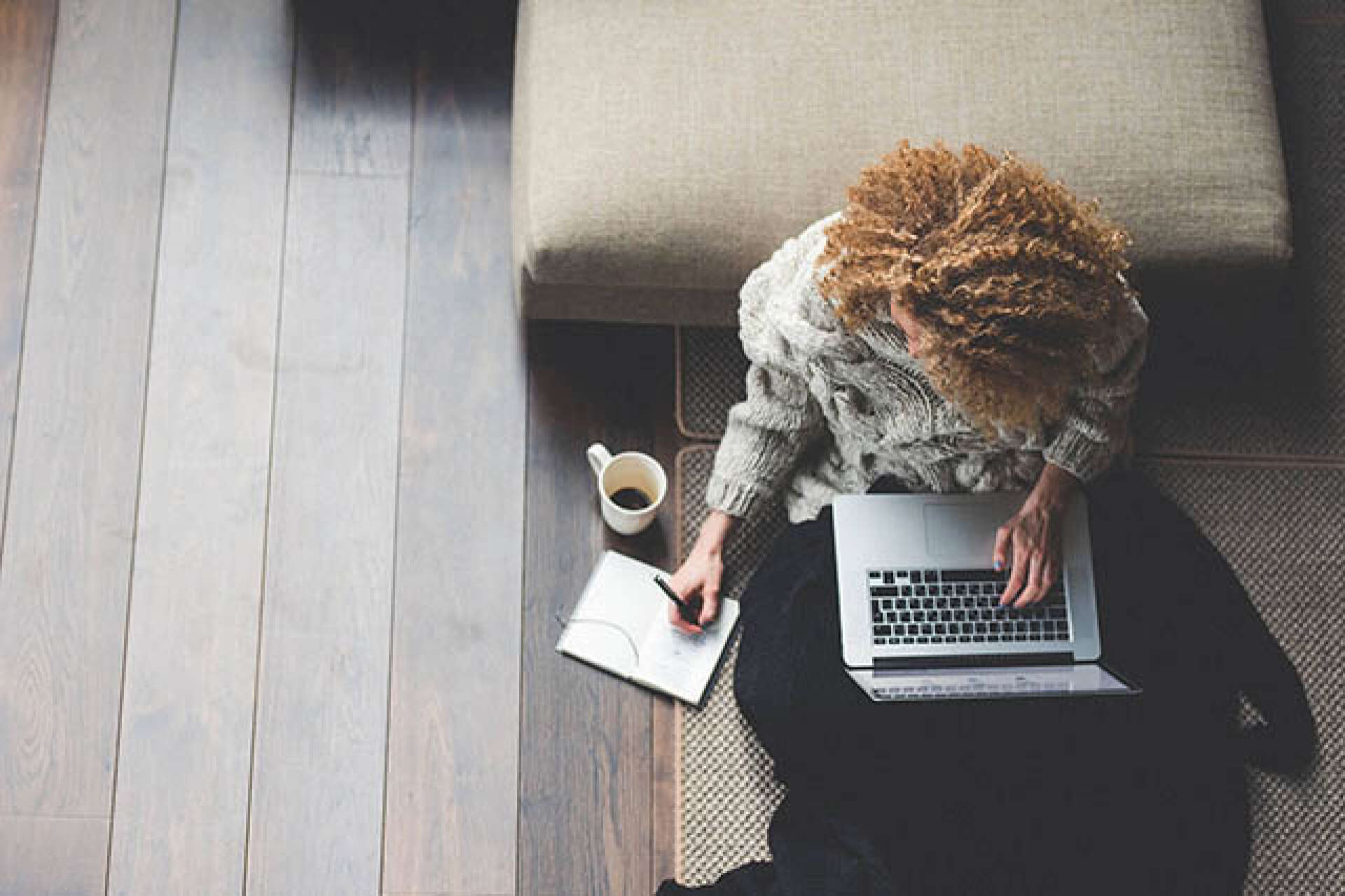 Student using a laptop at a desk, shot from above