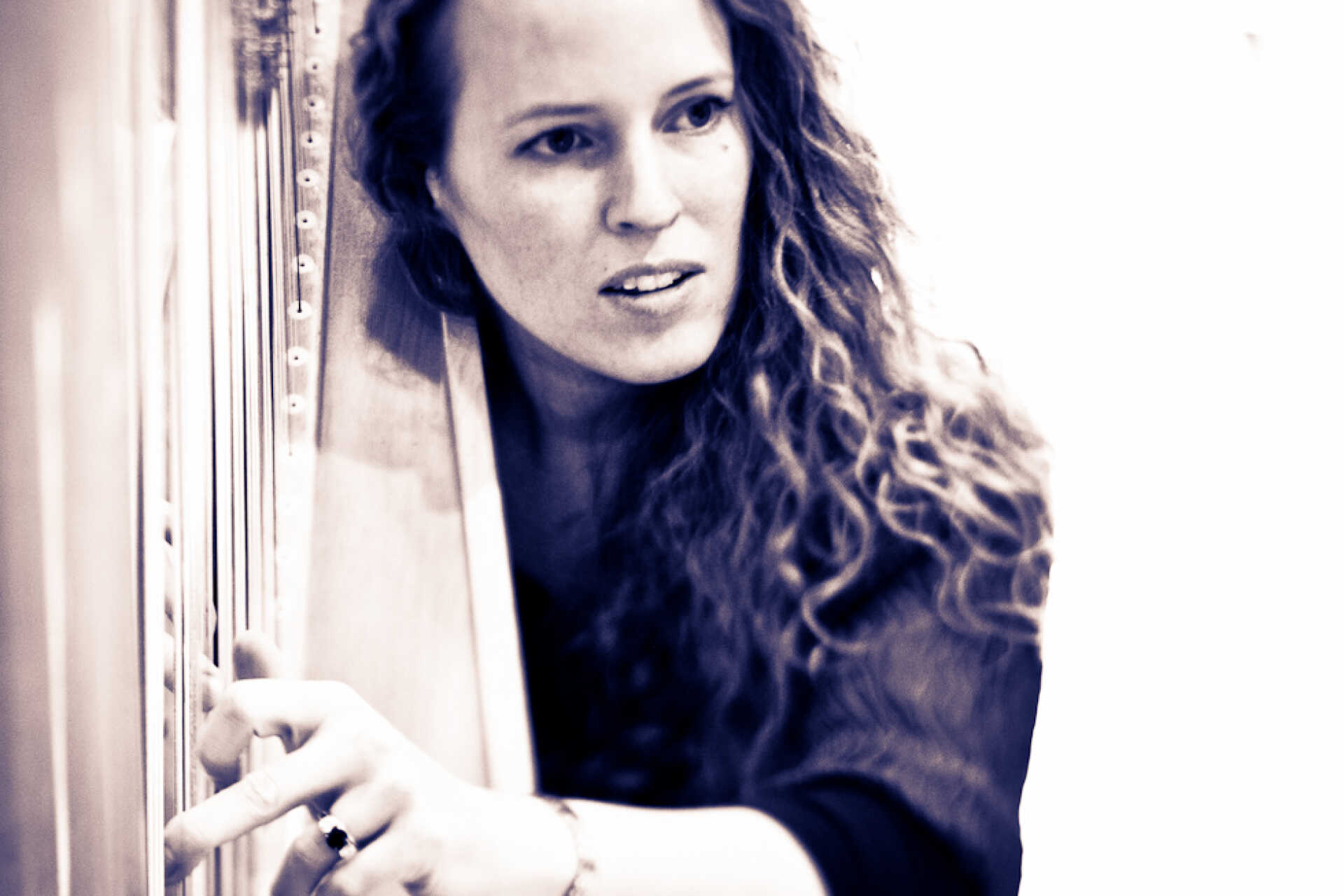 Close-up of female harpist