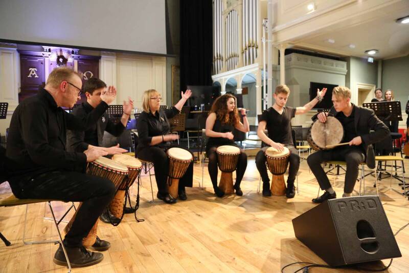 Mixed group of musicians rehearsing in the 19th-century Royal Dockyard church