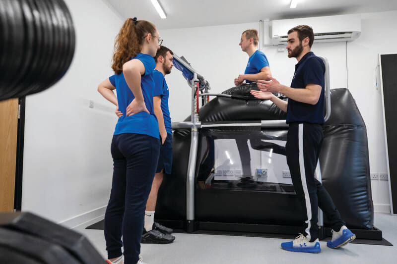 students working with the anti gravity treadmill