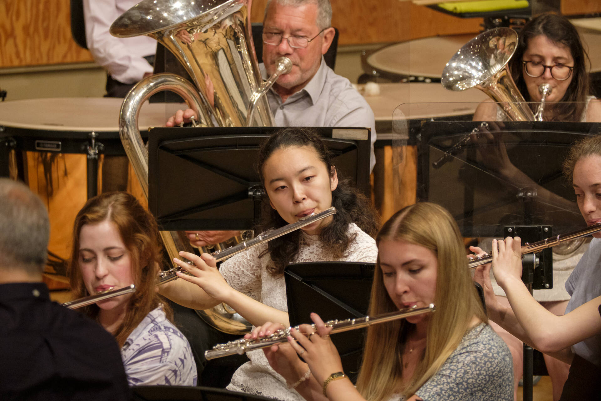 Close up of woodwind and brass players performing