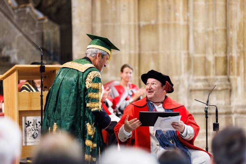 Mark Lane receiving his honorary degree from Chancellor, Gavin Esler