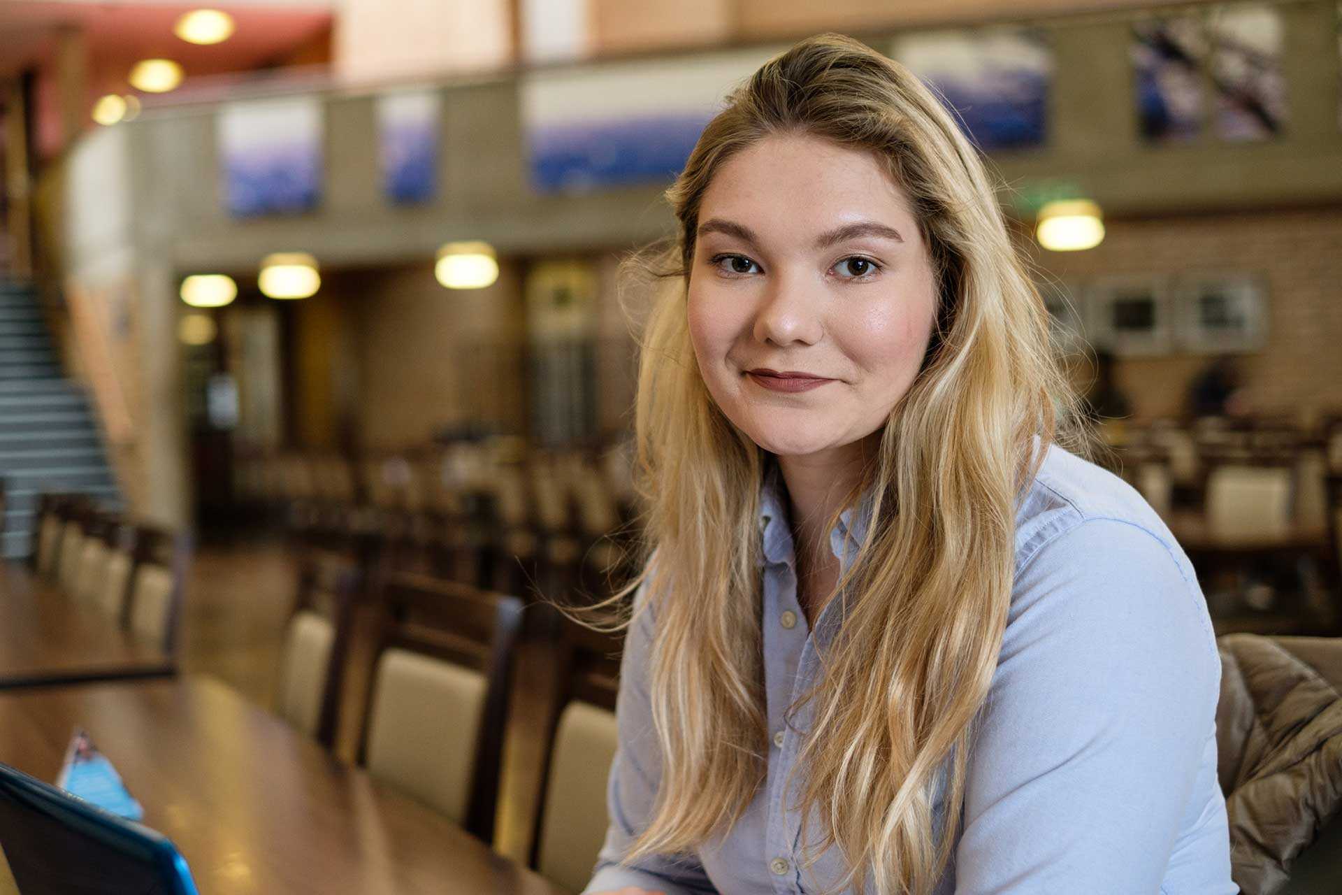 Maria Valentina Bruns, blonde hair, brown eyes, blue shirt