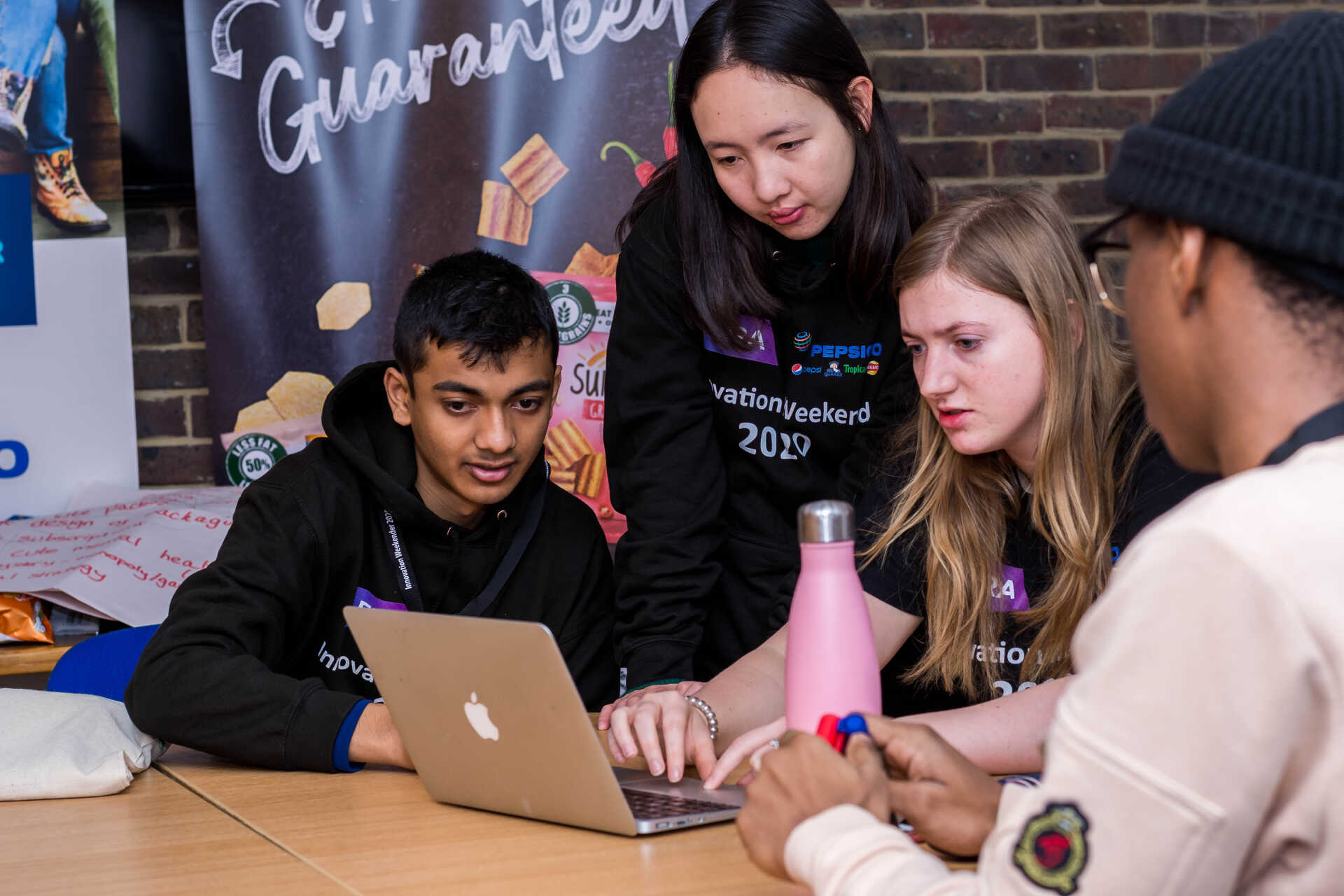 Student looking at a laptop screen at the Weekender