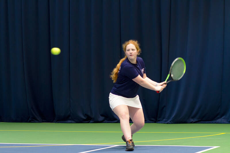 University Tennis Club President Sophie Kitson returning a shot on one of the indoor courts.
