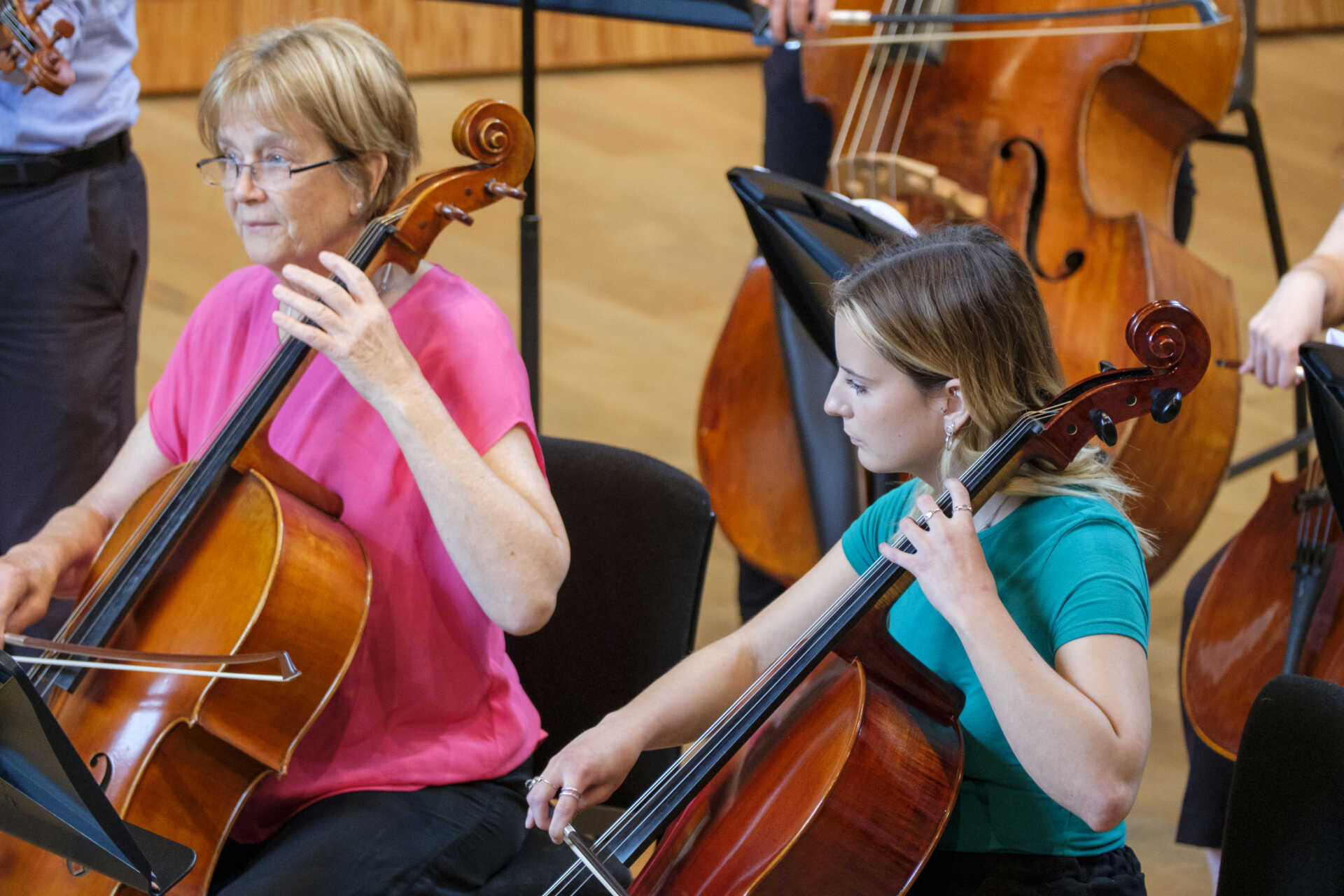 Two female cellists in rehearsal