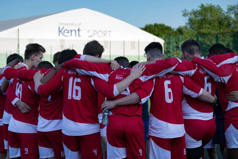 Group of footballers in a huddle