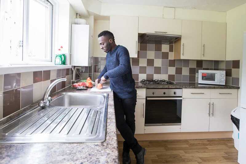 Male student washing up