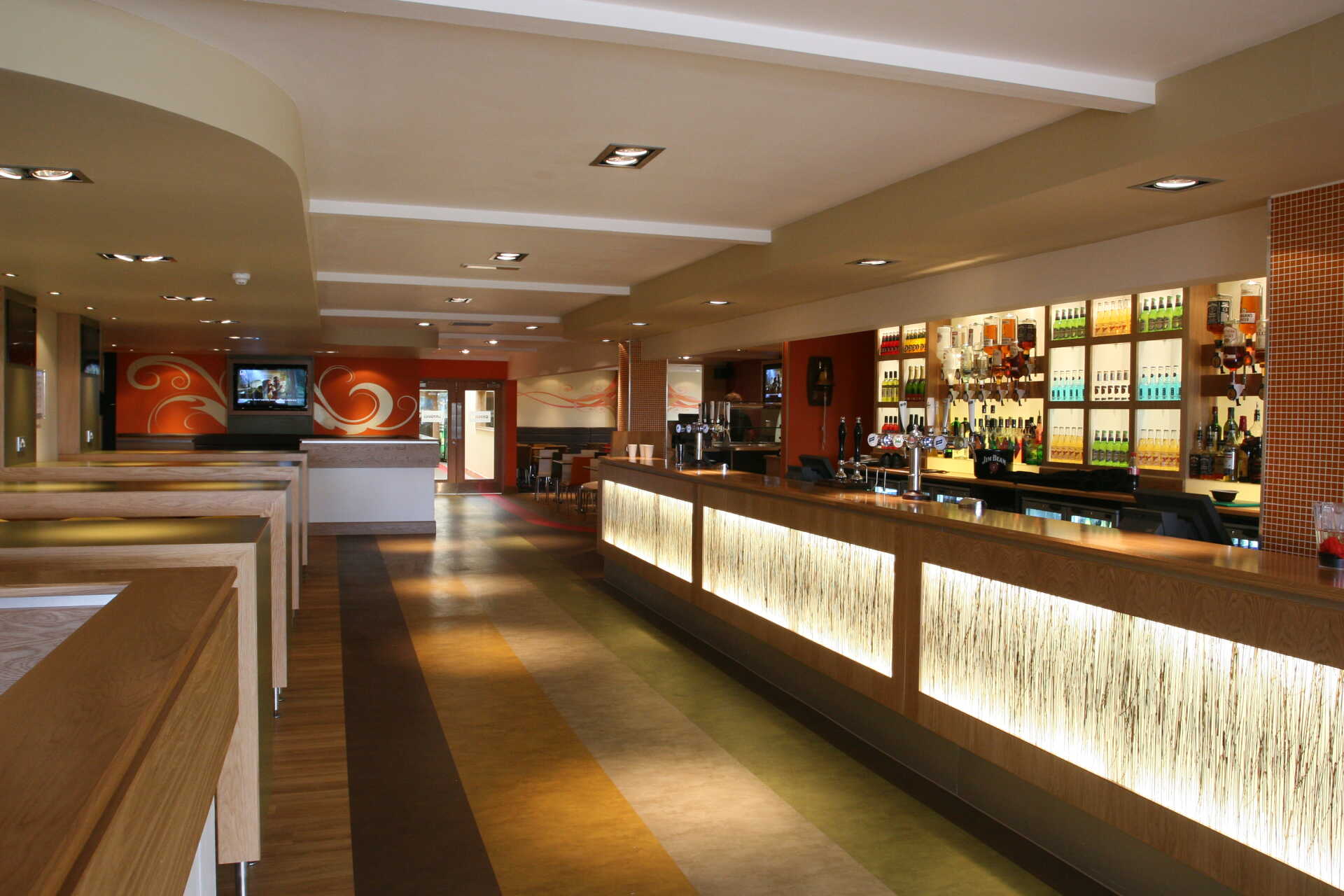 The interior of Origins, featuring the bar and seating area