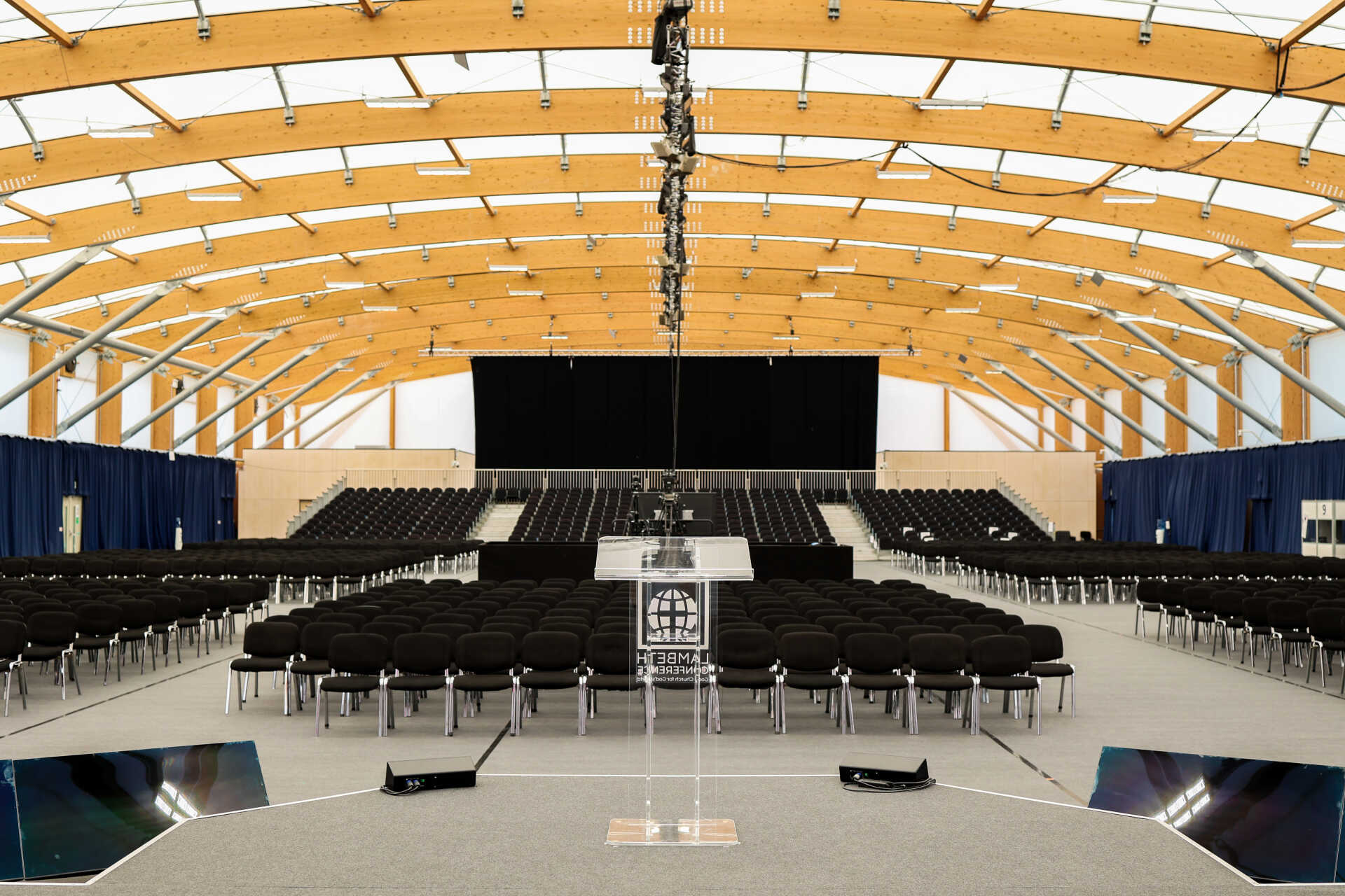 Kent Indoor Tennis and Events Arena set up with chairs for a conference.