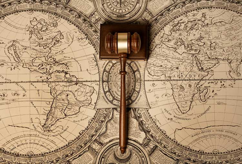 Antique map of the world with gavel