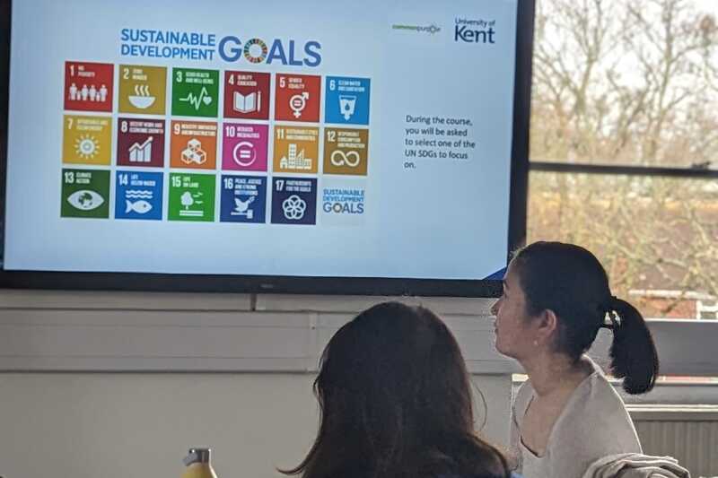 students looking at the UN SDGs