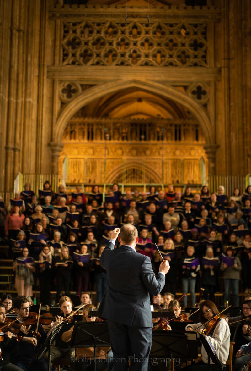 University Chorus and Symphony Orchestra in the Nave of Canterbury Cathedral