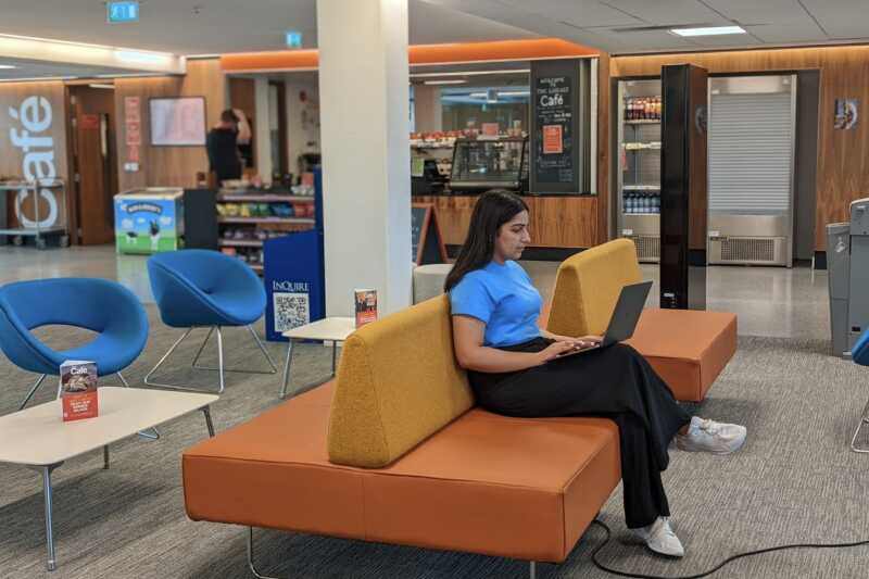 Psychology Student reading in the library.