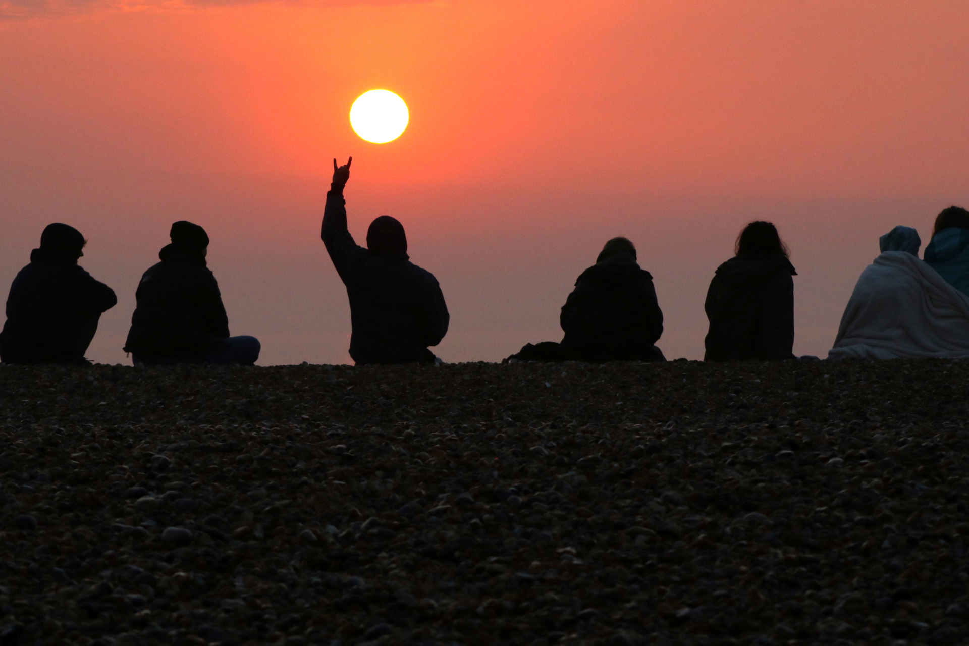 Group shot of students at sunrise on the Sandwich Bay  field trip.