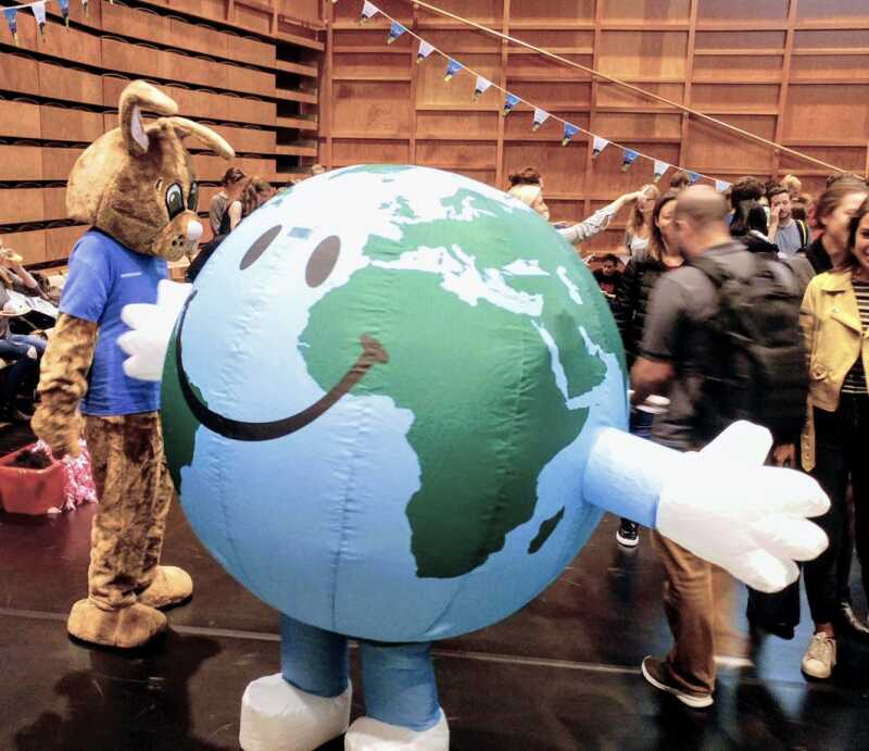 A picture of a person dressed as a globe