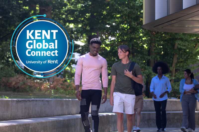 Students walking together on the University of Kent campus.