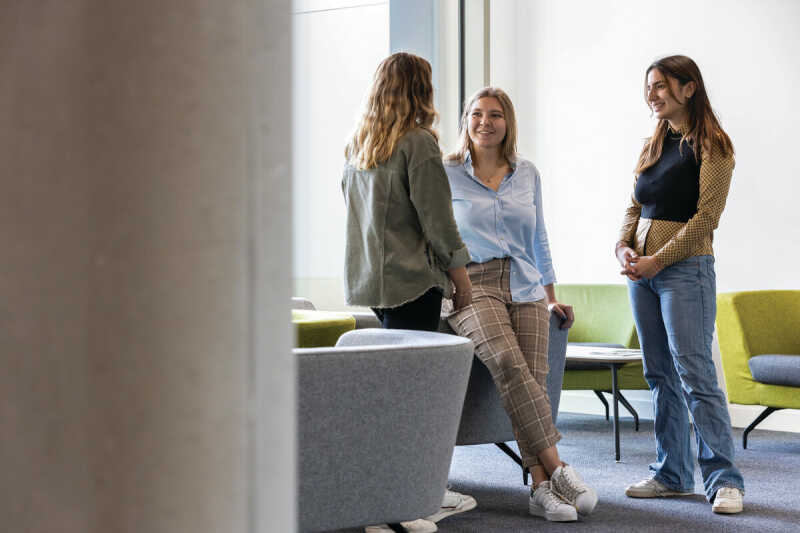 Postgraduate students chatting.