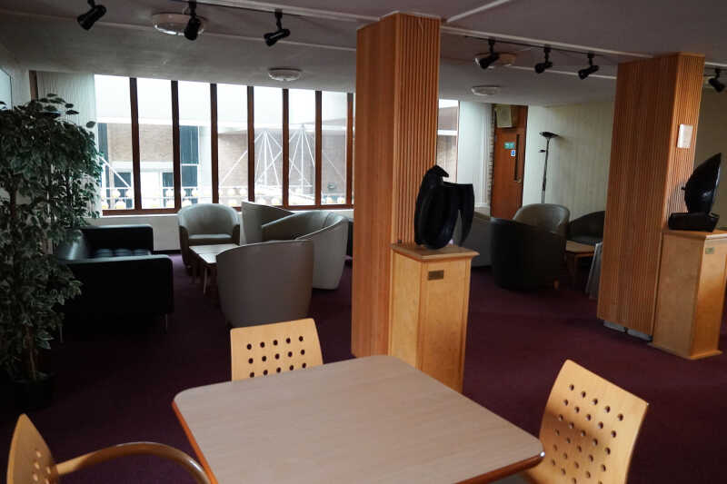 Eliot lounge showing table and chats, seating and sculptures