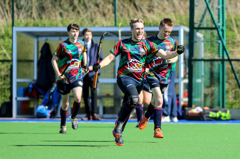 Students celebrating during hockey match