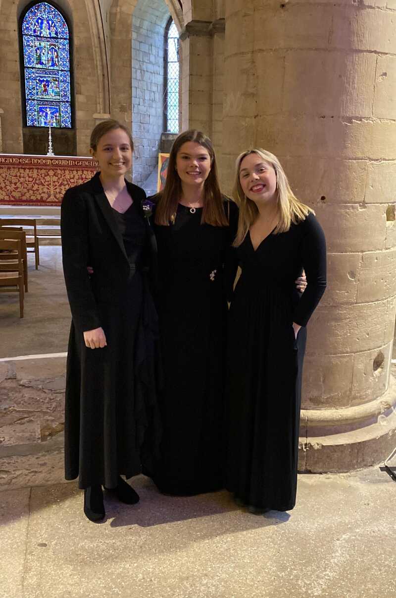 Three students in concert-dress