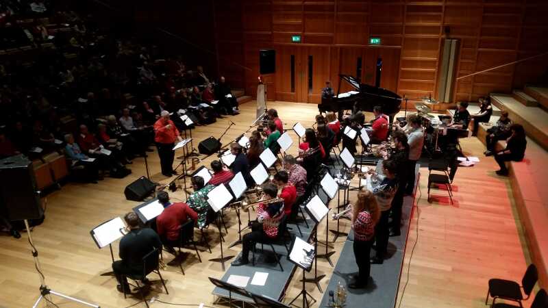 Group of musicians playing in a concert hall