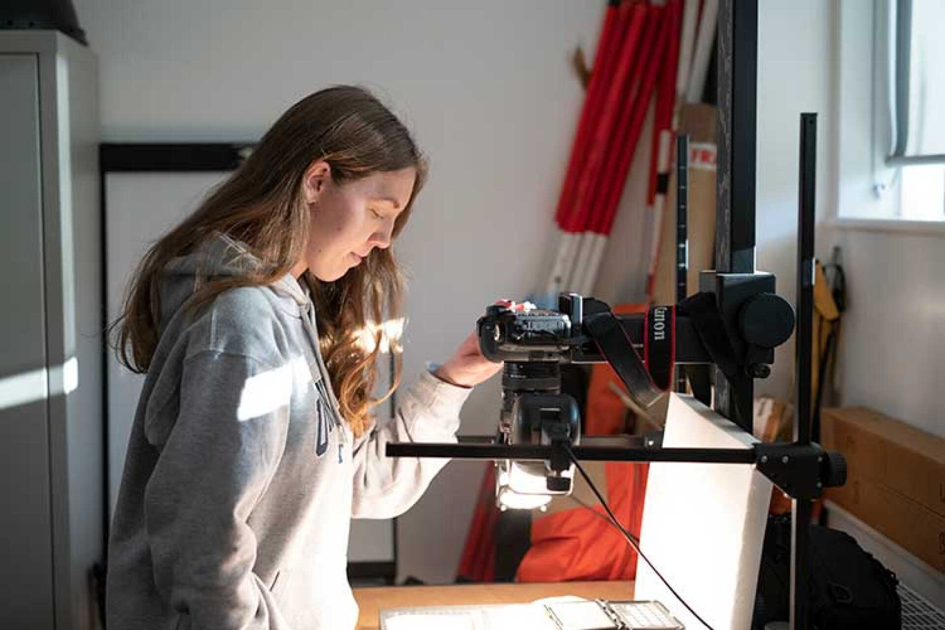 A students using equipment in the archaeology lab.