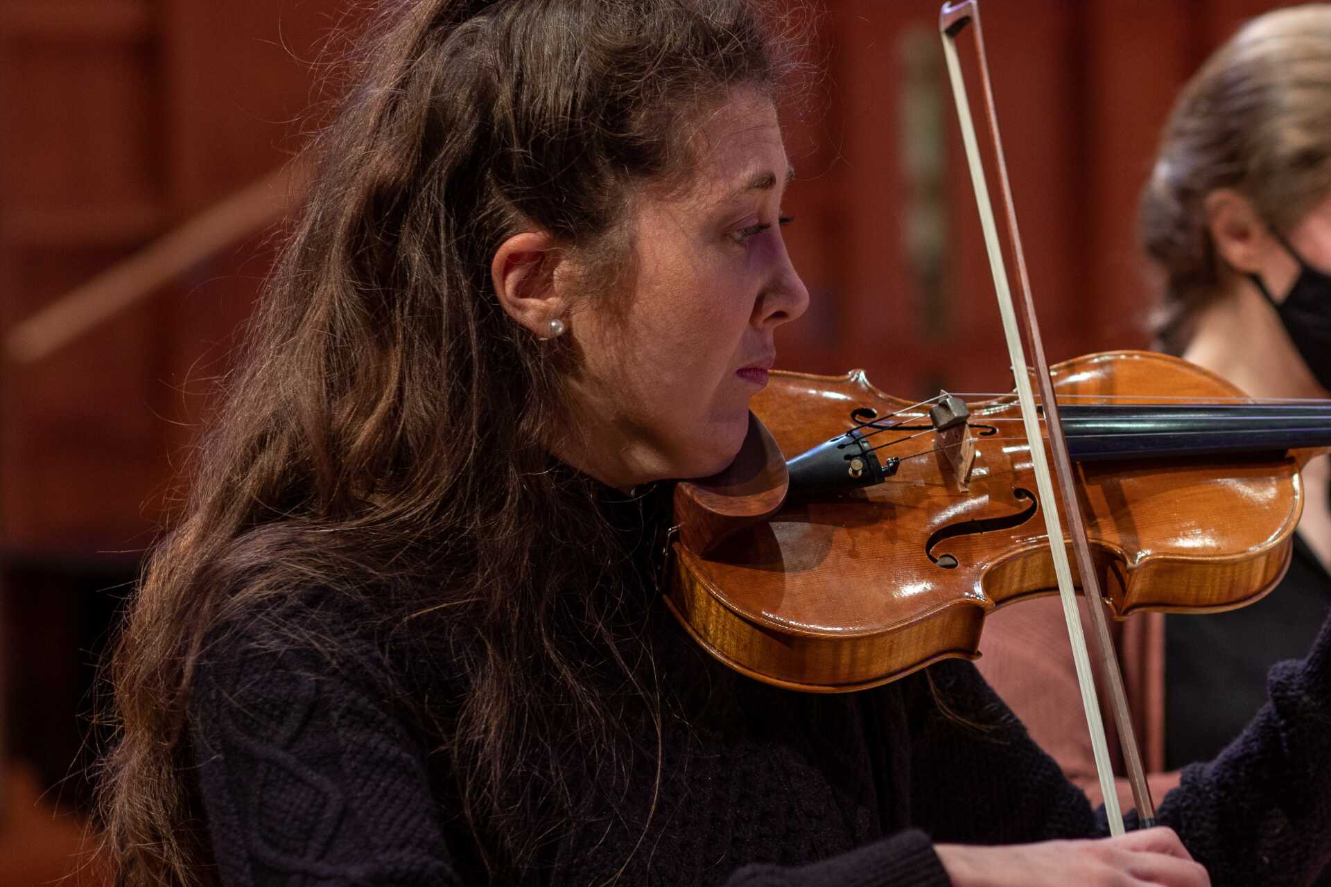 Female violinist in rehearsal