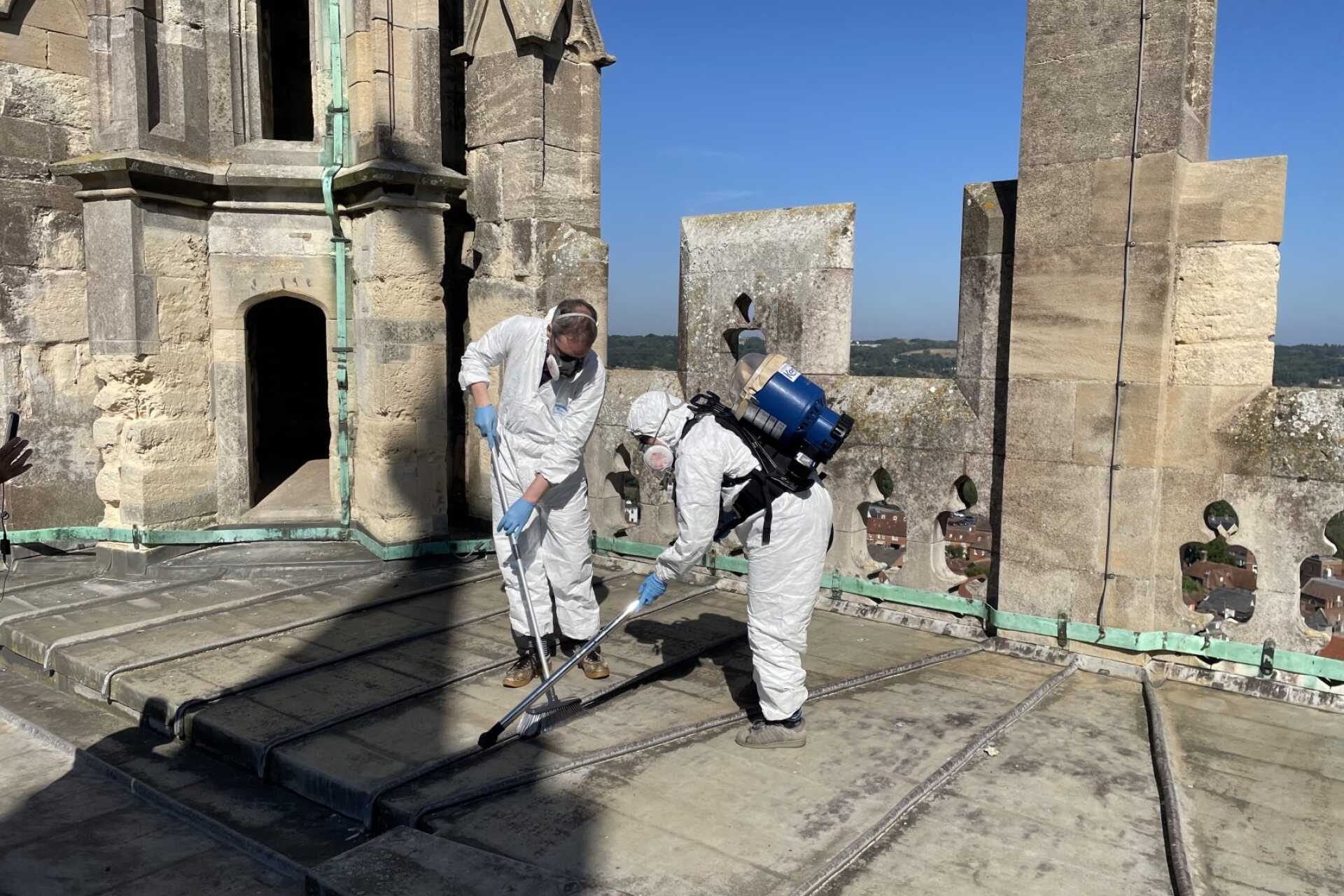 Scientists on the roof of Canterbury Cathedral searching for urban micrometeorites