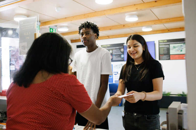 Two students at reception