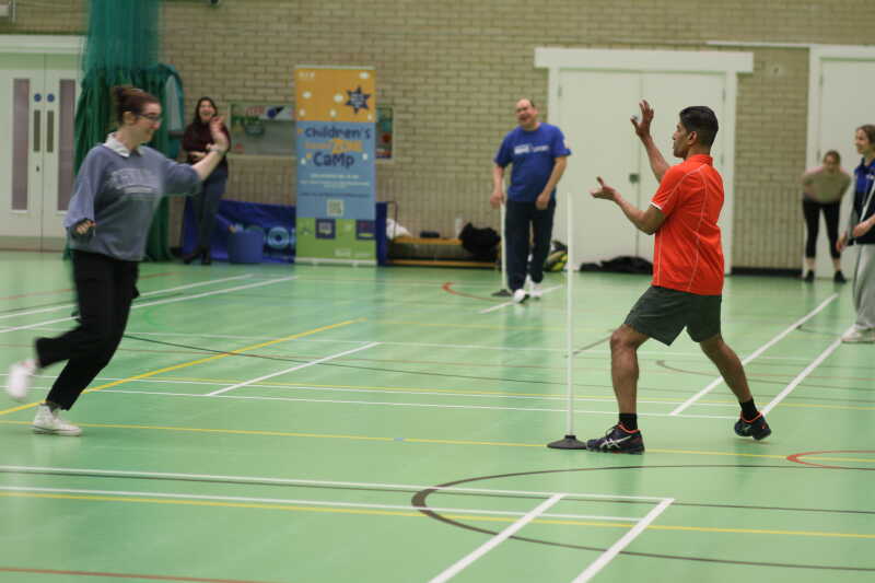 Staff playing rounders in the Sports Hall