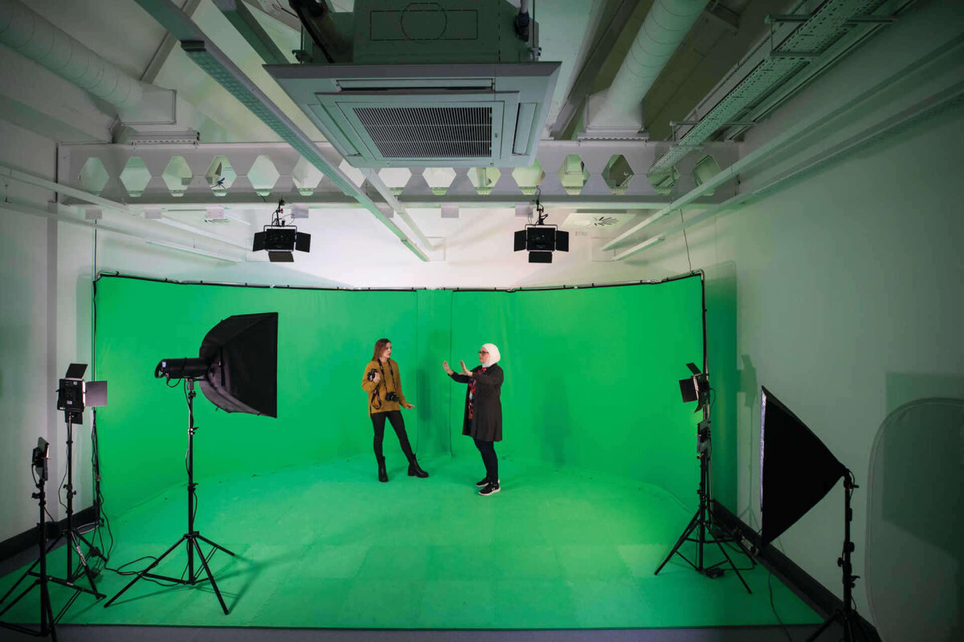 Two women in a filming studio