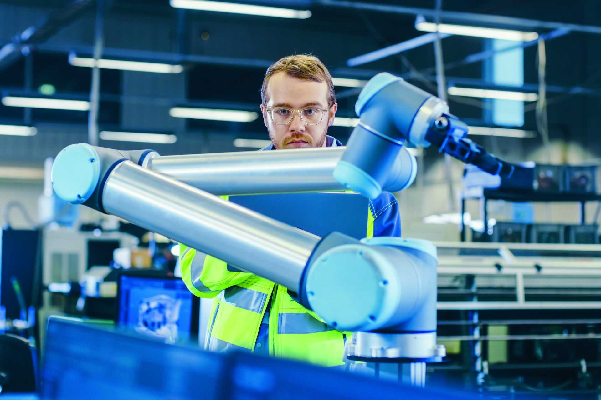 Decorative. A man on placement with a robot arm