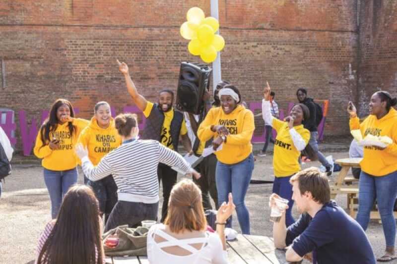 A group of students dancing and singing