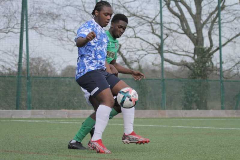 Two students playing football