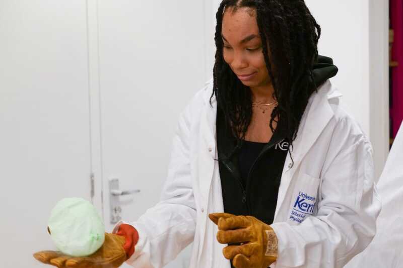 STEM Outreach Officer Megan Bell experiments with children at Discovery Planet (photo credit: Jaron James).