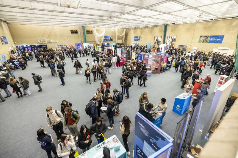 Image taken from the UK University Search Fair, of the sports hall set-up as an exhibition.