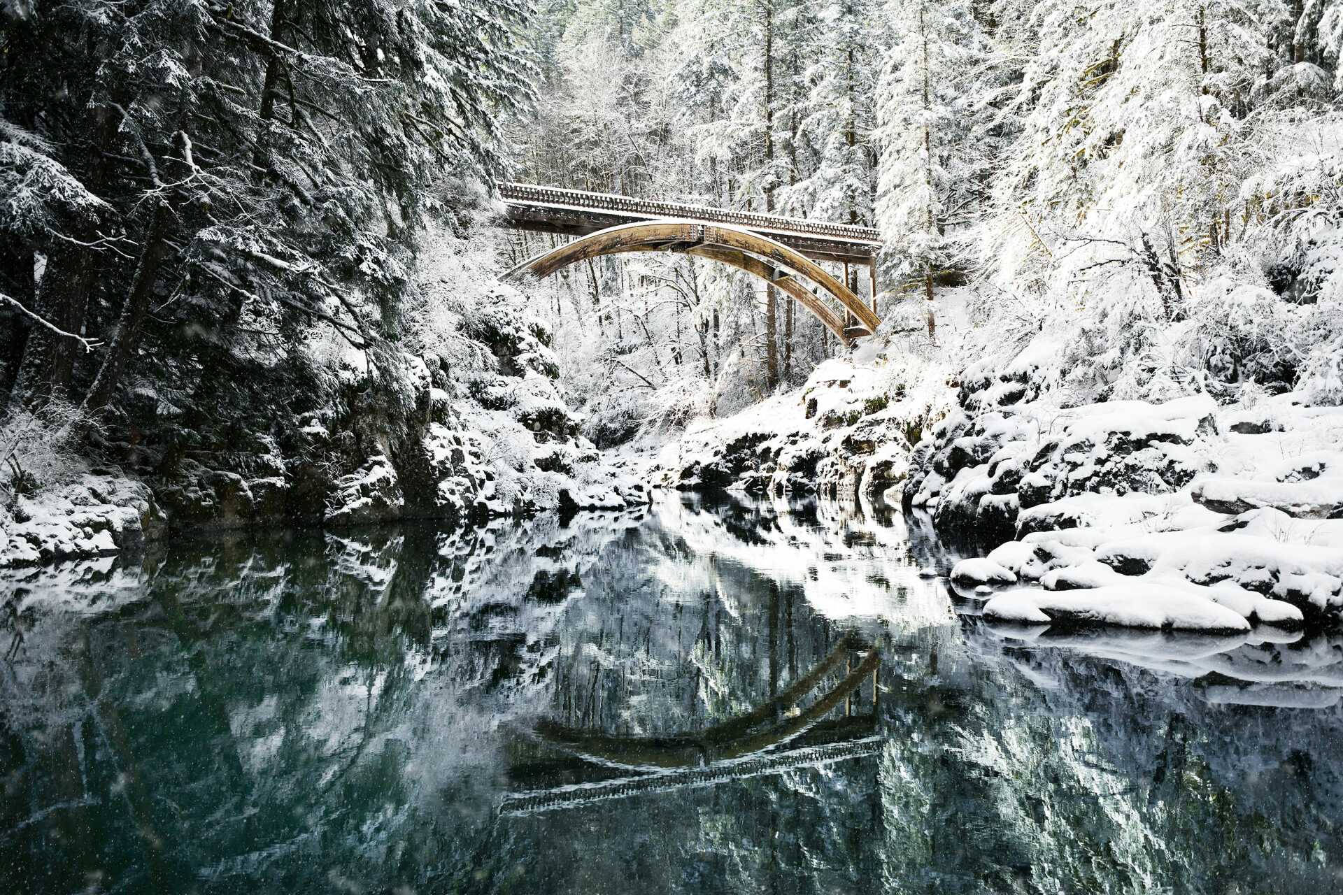 View of a viaduct across a stream in winter