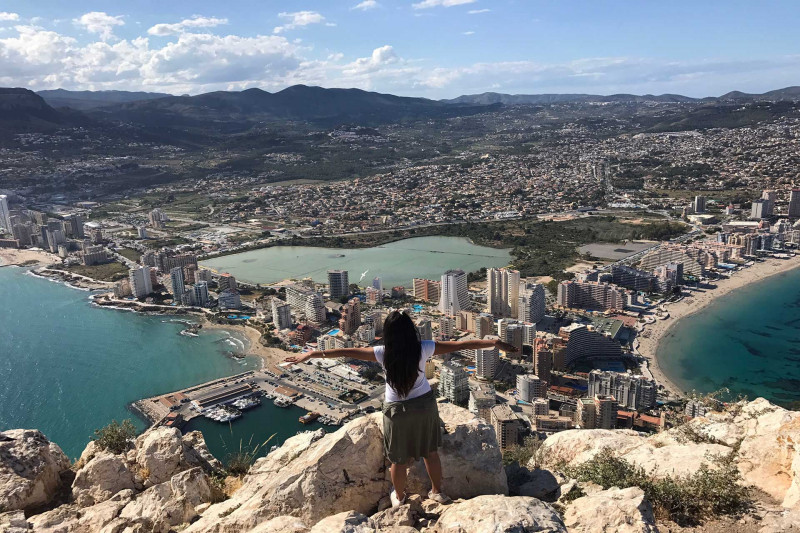 Student at top of the Penon De Ifach in Spain