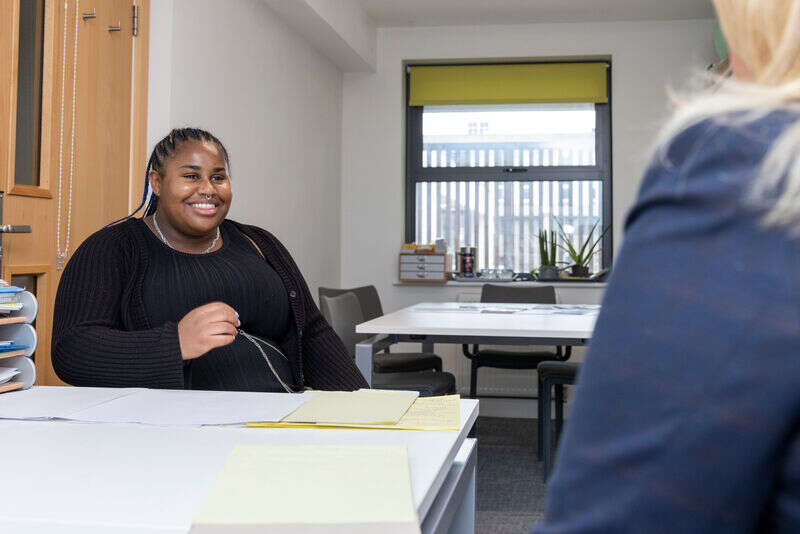 student and Jackie in office
