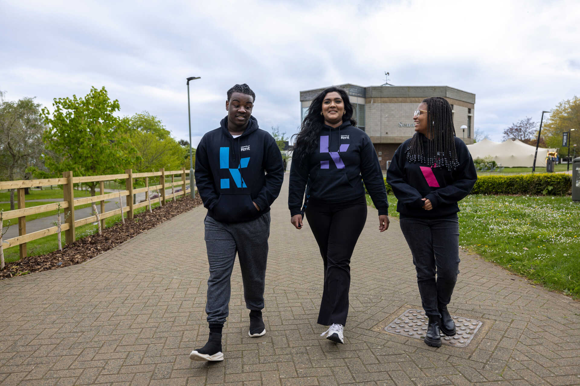 Three University of Kent students on the Canterbury campus.