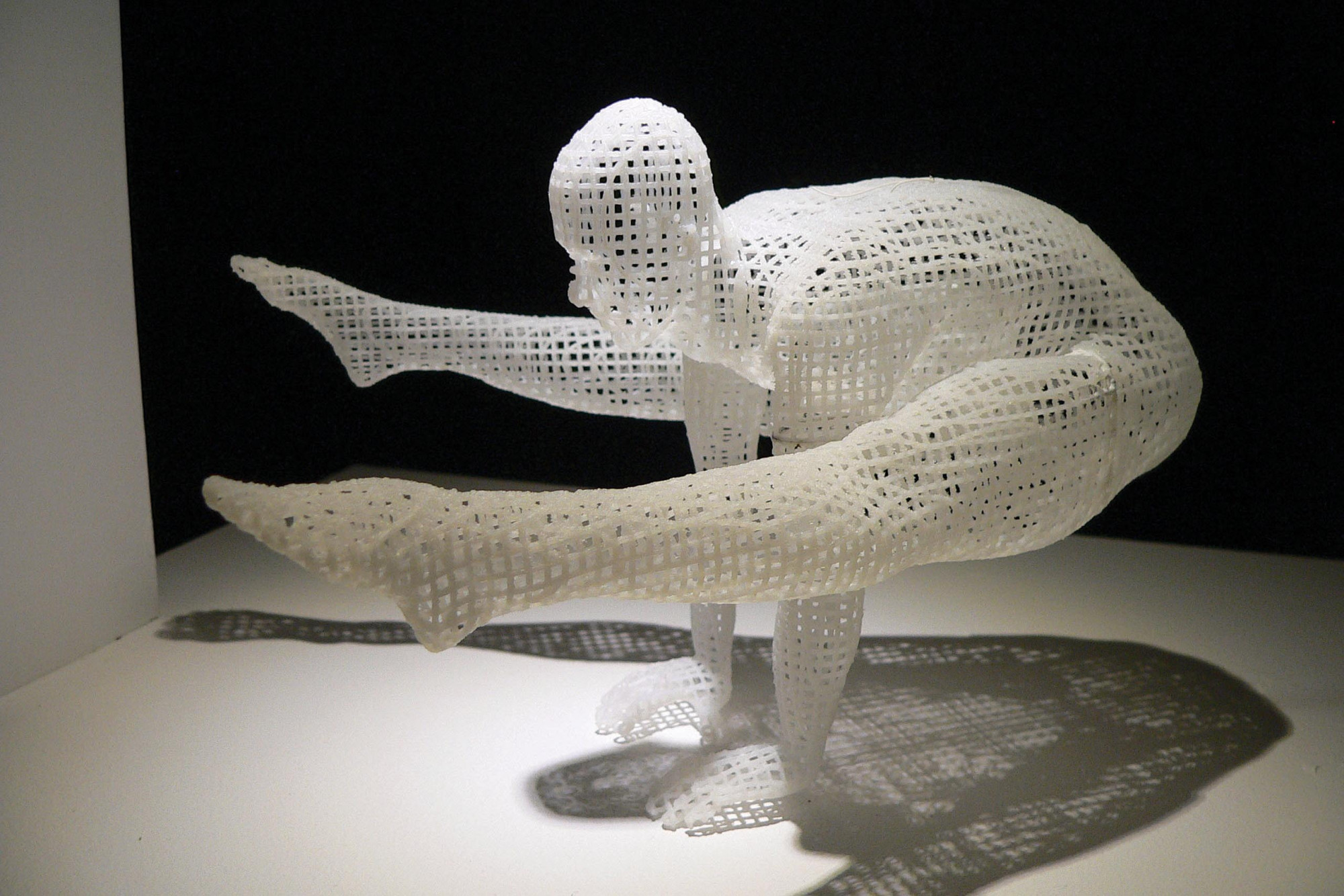 Digital sculpture of a human form in a yoga position
