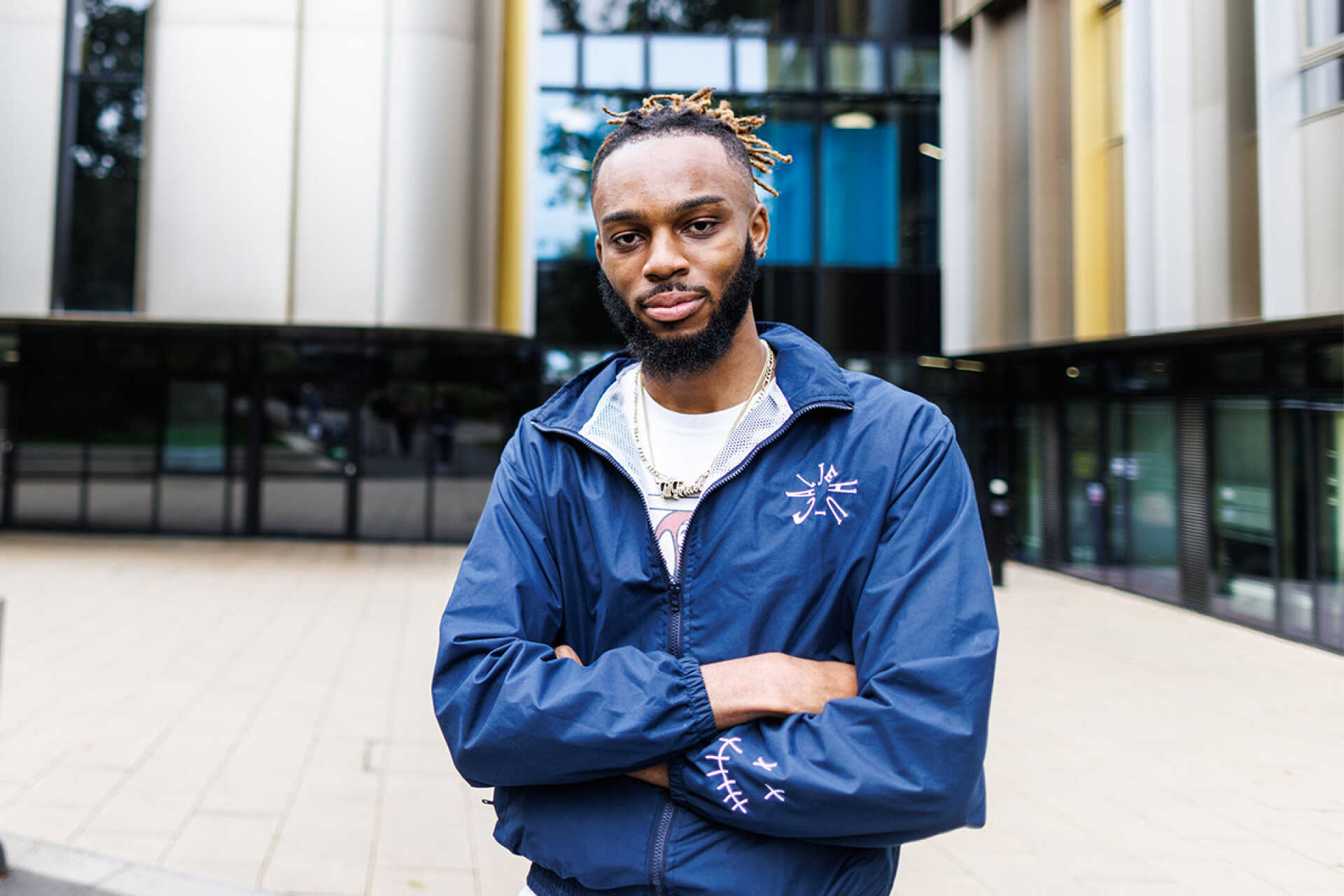 Male graduate looking directly at you