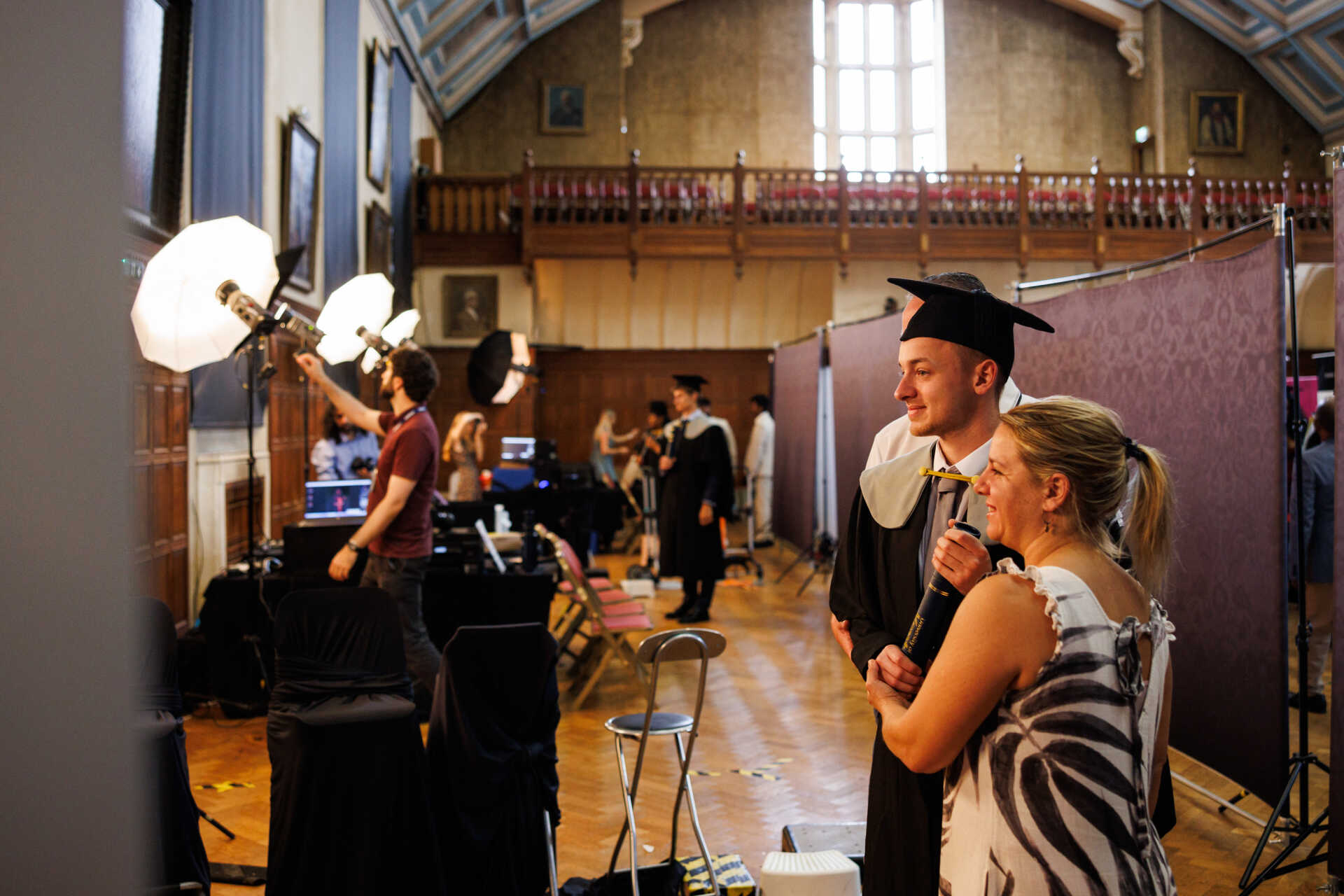 A graduate and his family having photographs taken